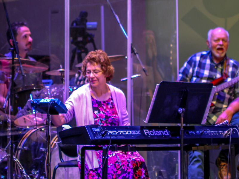 The worship team playing music during service